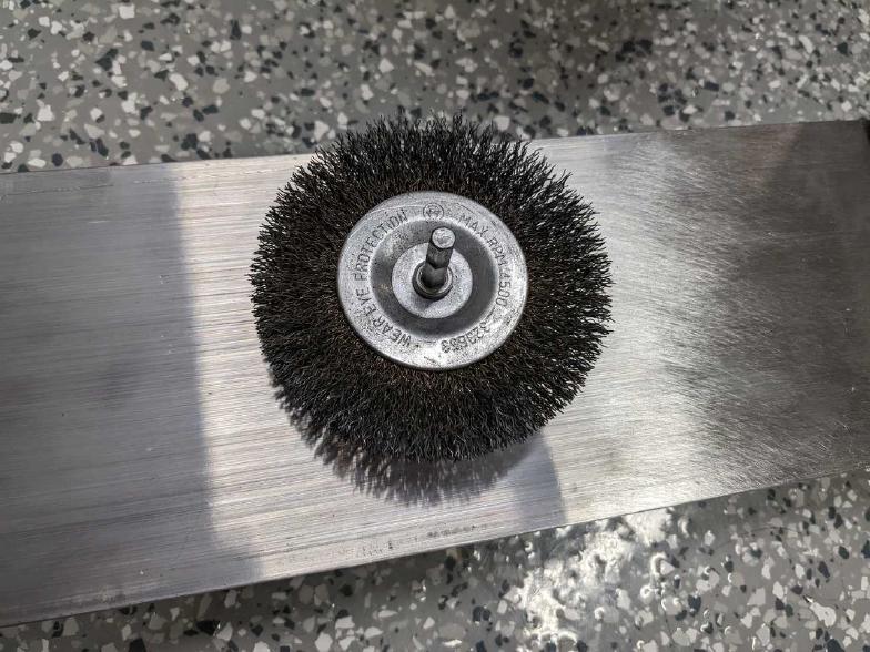 Brass wheel brush; moved to a cone later.