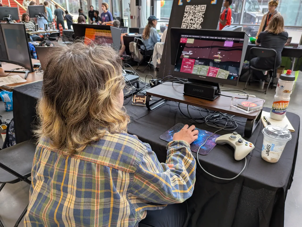 An attendee strategizing while playing The Patchwork Ship