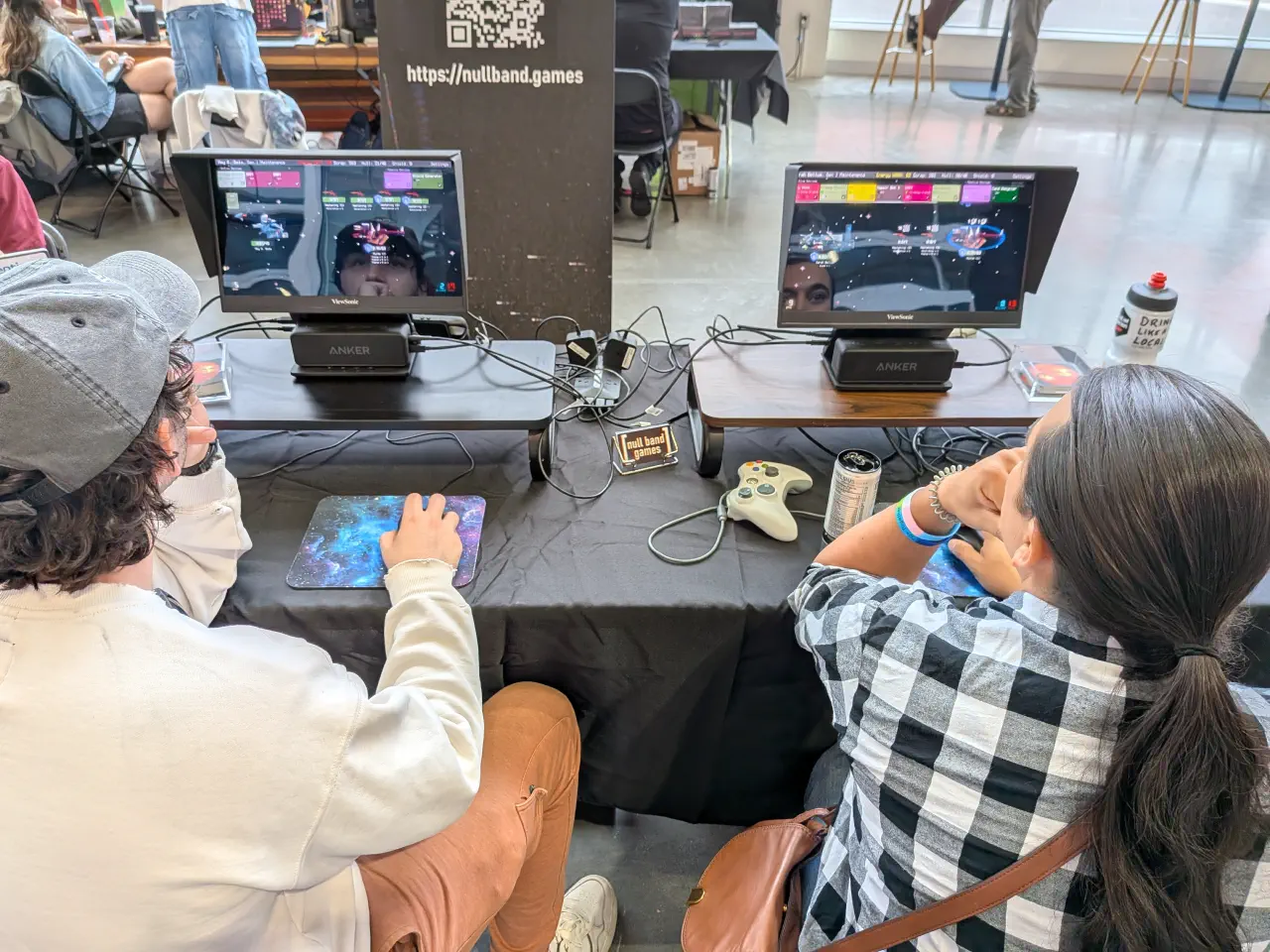 Two people fighting the first stage boss in The Patchwork Ship
